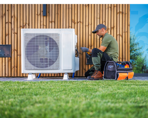 professional heat pump technician servicing a heat pump outside an Aurora, CO modern home