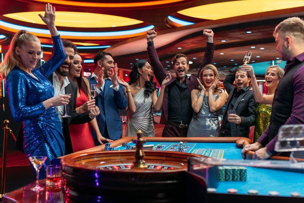 A group of people are playing roulette in a casino.