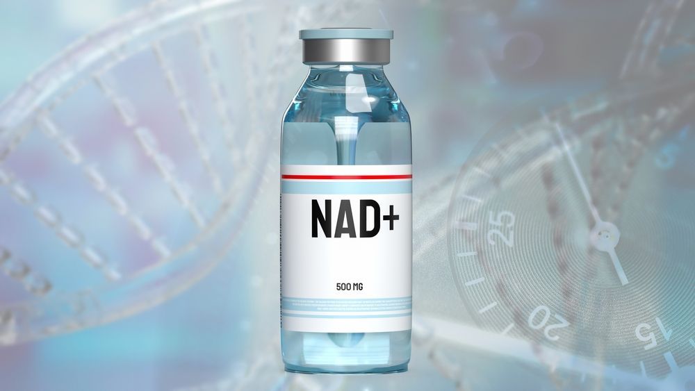 A bottle of nad + is sitting in front of a dna structure.