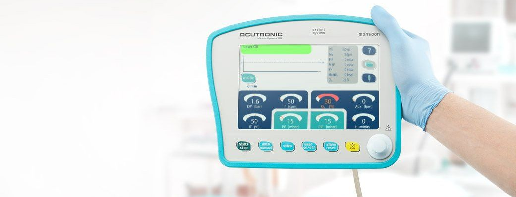 Susquehanna Micro employee holding Acutronic Monsoon III Jet Ventilator