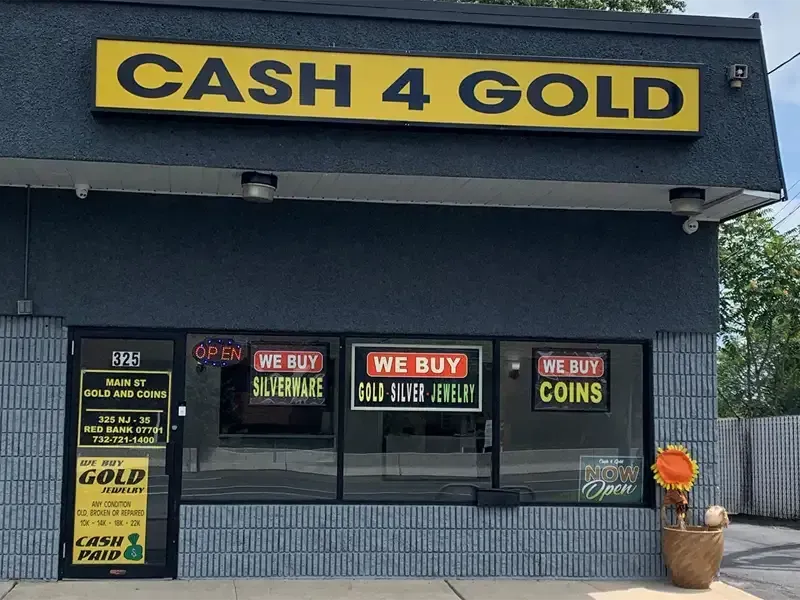 Storefront of Main Street Gold and Coins in Red Bank NJ with "Cash 4 Gold" sign and we buy gold, silver, coins, and silverware.