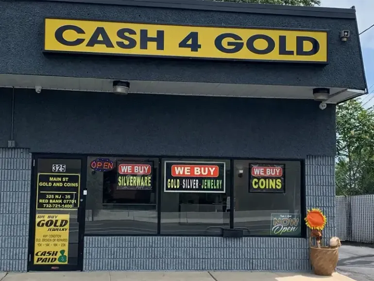 Storefront of Main Street Gold and Coins in Red Bank NJ with "Cash 4 Gold" sign and we buy gold, silver, coins, and silverware.