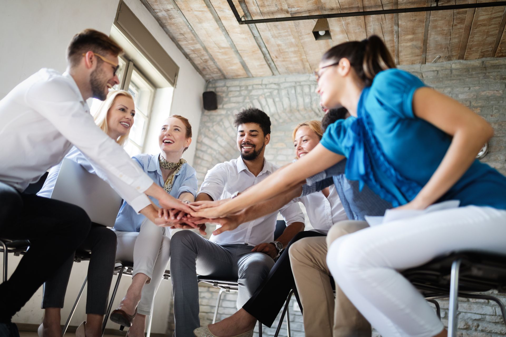 Business team celebrating a successful decision together in the office