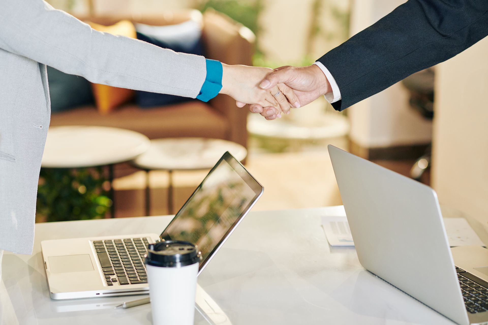 Business partnership handshake — franchise coaching
