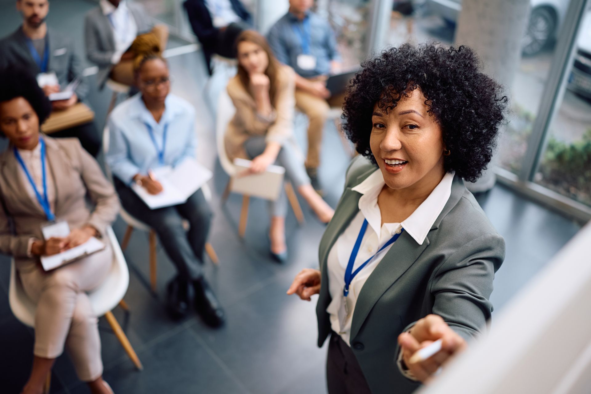 Executive coach leading a leadership seminar with business professionals