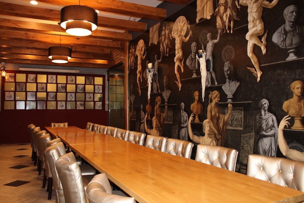 Main dining area with private dining in background at Romanissimo Cucina Italiana in Gaslamp Quarter. 