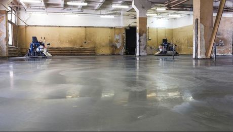 Picture of a concrete slab being finalised in an underground carpark in Cairns.