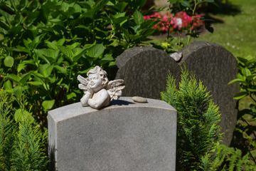 Little Angel Lies on a Marble Tombstone — Granite Slant in Adam, CO