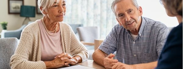 Older couple meeting with elder law attorney about estate planning for an early dementia diagnosis.