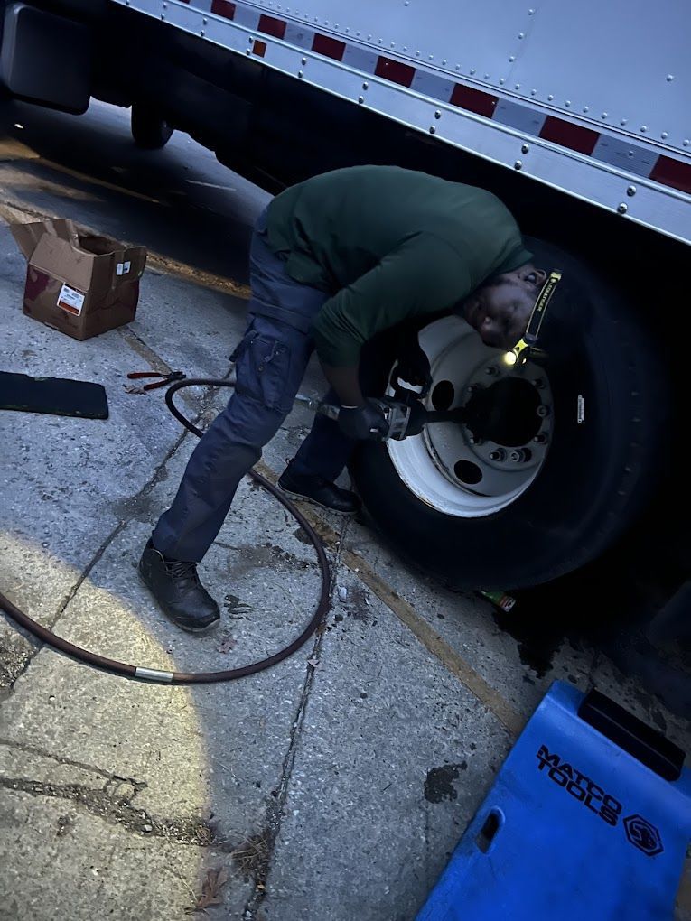 Blue car engine bay with a modified Honda engine and turbocharger.