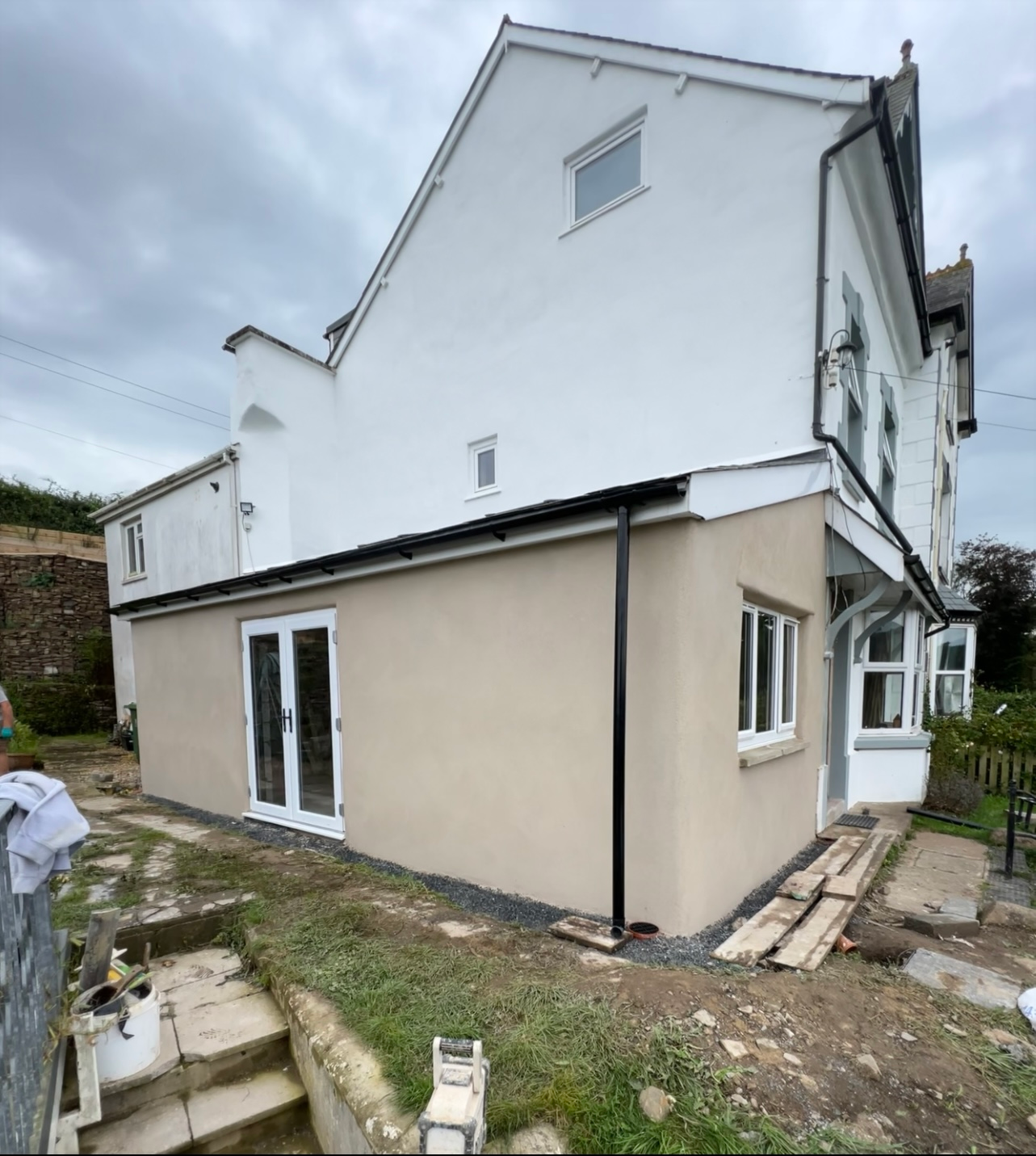 A large white house with a lot of windows and doors