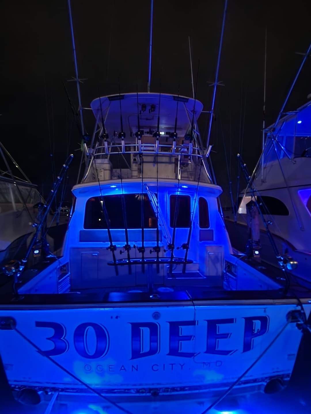 A boat that says 30 deep on the back of it