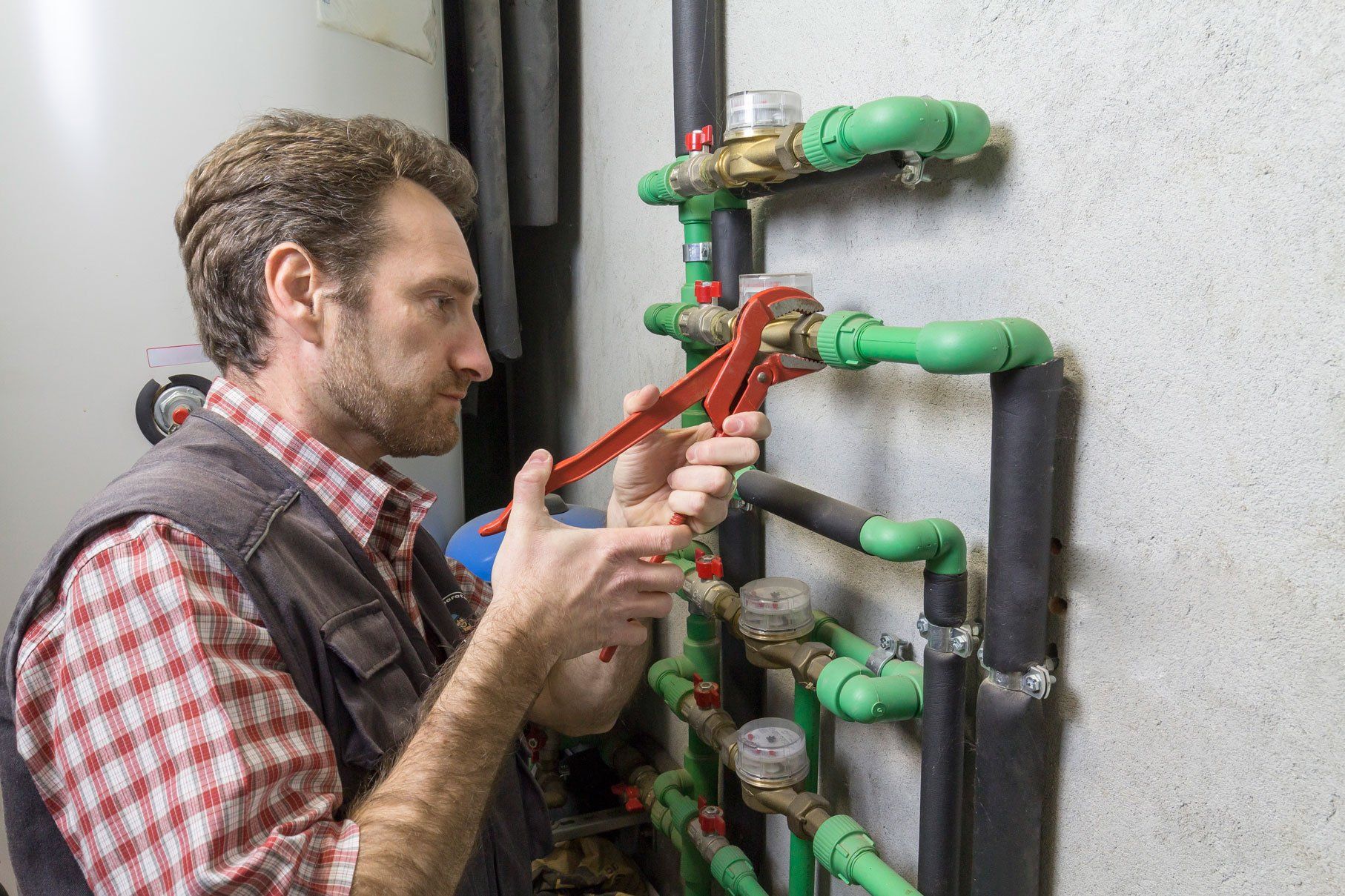 Plumbing Services — Plumber Repairing Water Meter in Pittsburgh, PA