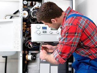 Heating Contractor — Technician fixing Heating Boiler in Pittsburgh, PA