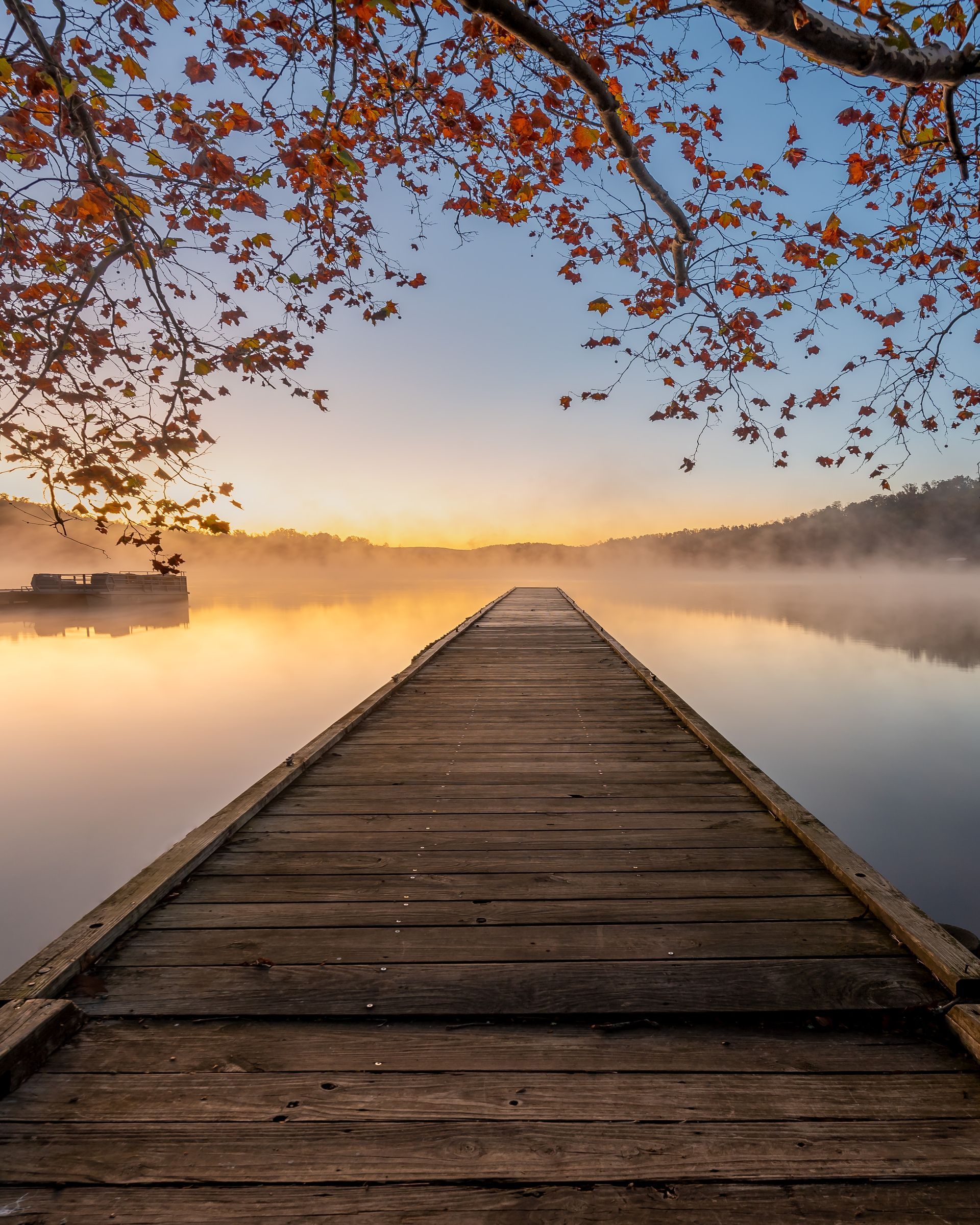 a wooden dock leading to a foggy lake at sunset . Lake Burton, Moccasin Creek State Park, Talking Excitingly, Brad Burgess Photography