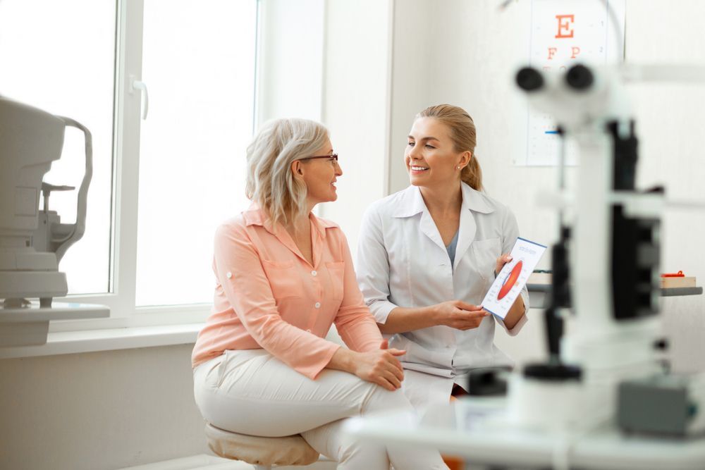 A Female Eye Doctor Shows a Patient a Diagram — Michael Chu Optometrist in Cairns North, QLD