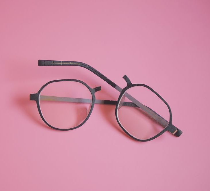 Pair of Eyeglasses With Mismatched Lenses and a Dark Frame — Michael Chu Optometrist in Cairns North, QLD