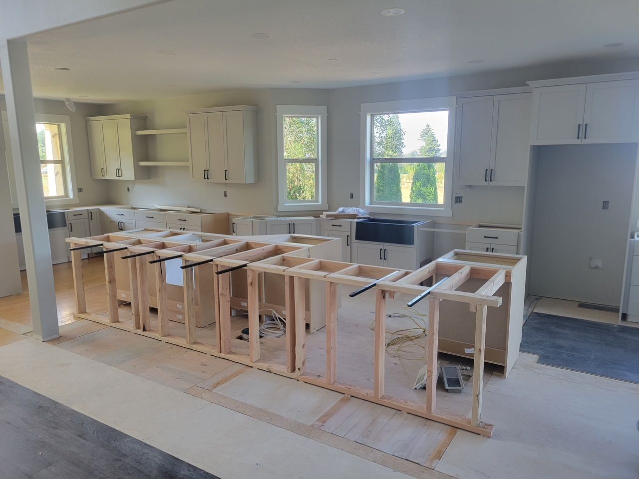 Wood frames for cabinets going up in a modern kitchen