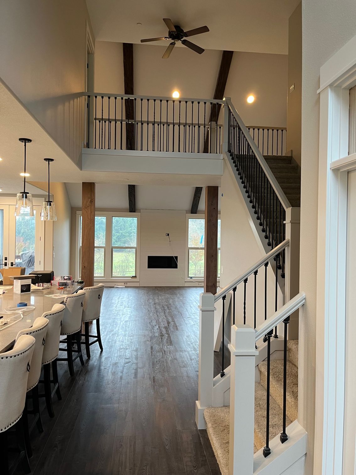 Beautiful freshly painted staircase next to a  fine dining table