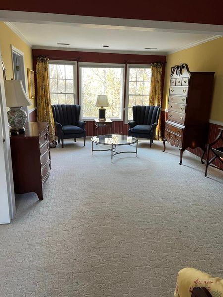 A living room with two chairs and a coffee table