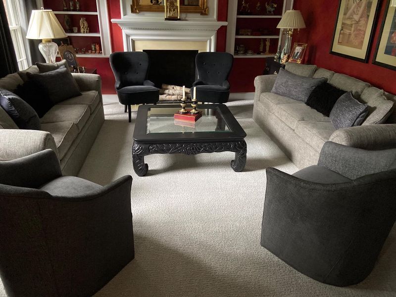 A living room filled with furniture and a fireplace