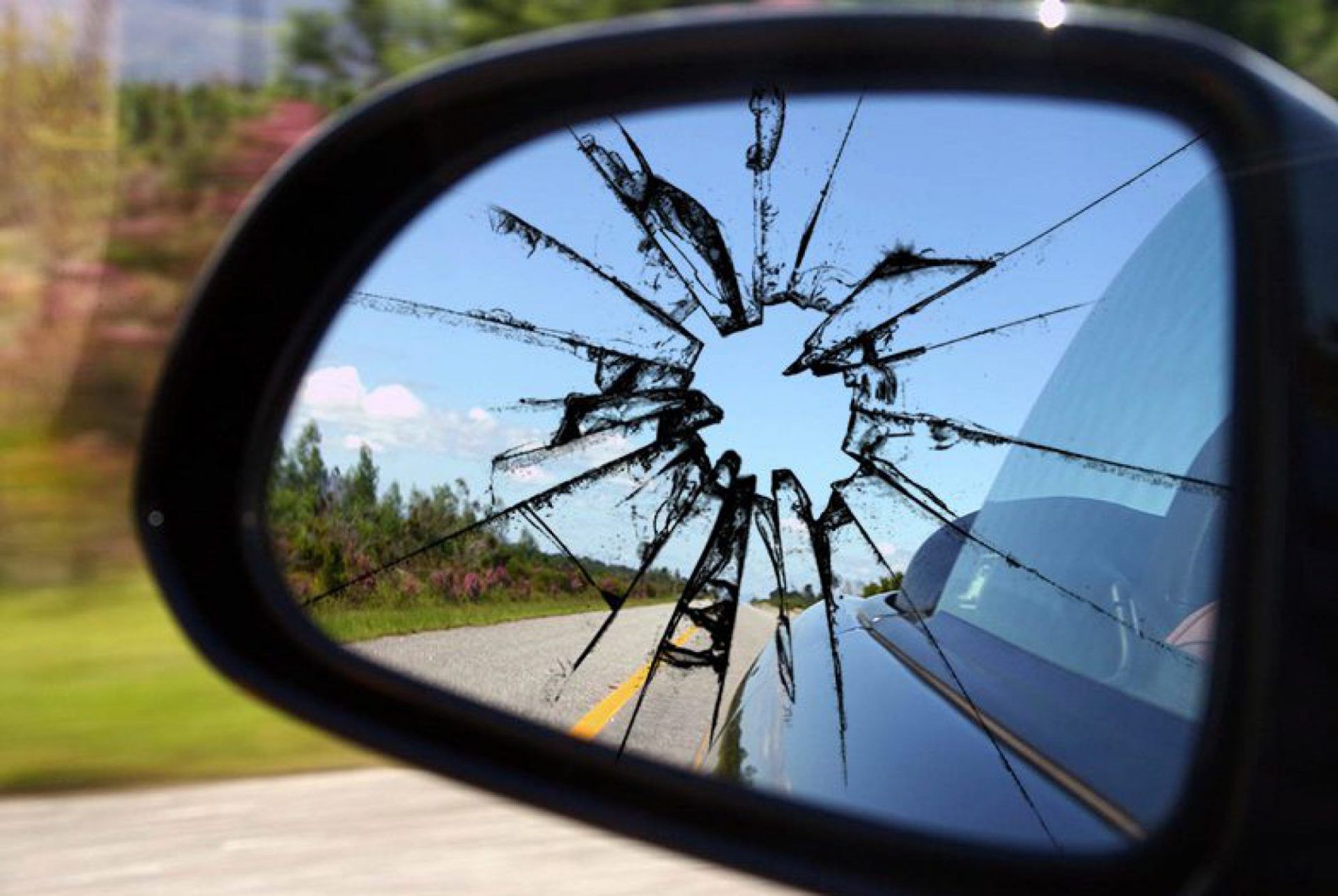 photo of side mirror damage that was sent to auto insurance for a claim to repair side mirror glass