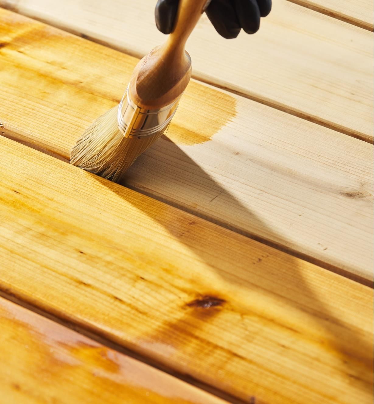 Application of decking oil by professional restoration service