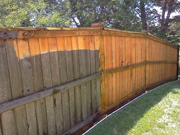 Fence cleaned by pressure washing to remove dirt and grime