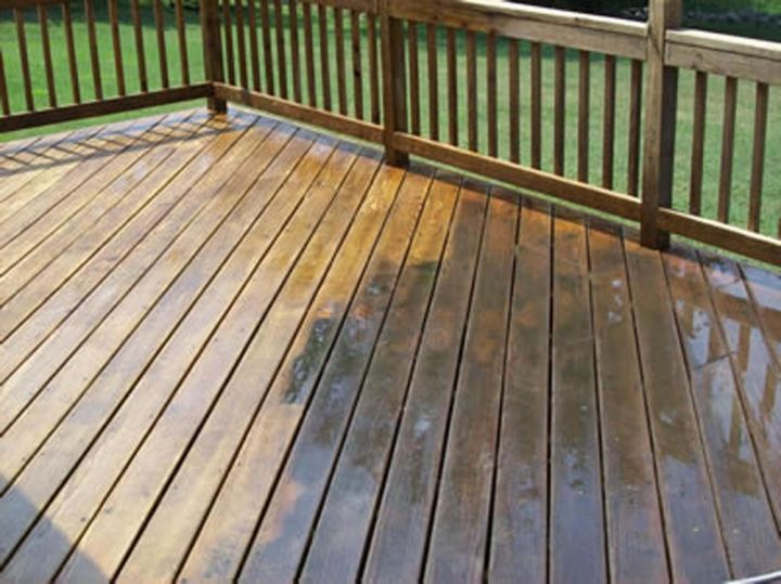 Pressure washing decking in preparation for restoration