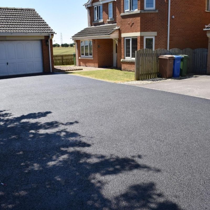 Driveway cleaning service, pressured washed, treated and sealed by Hedon Exterior Cleaning