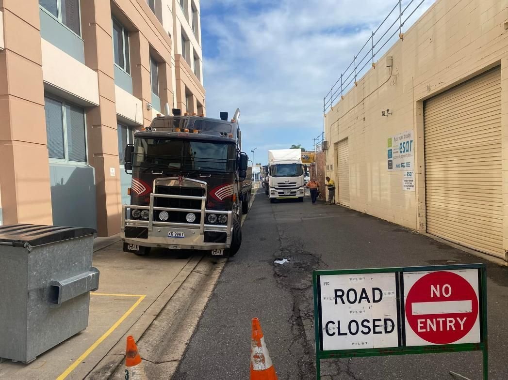 A Truck Is Parked Next to A Sign that Says Road Closed — White's Truck & Machinery Hire in Bouldercombe, QLD