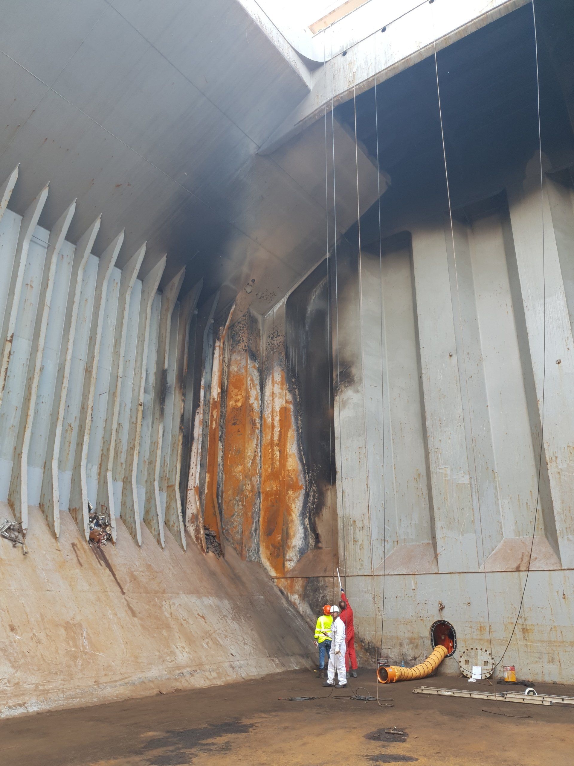 A cargohold affected by a fire and showing the steel has been damaged. Marine fire investigation