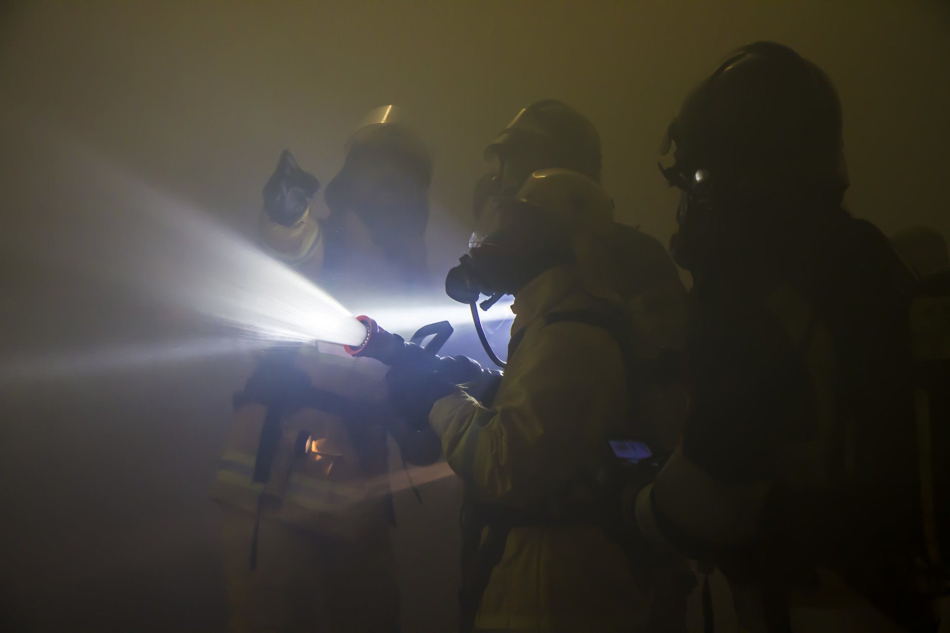 Firefighters conducting firefighting on board of a passenger ship. Marine firefighting, shipboard firefighting