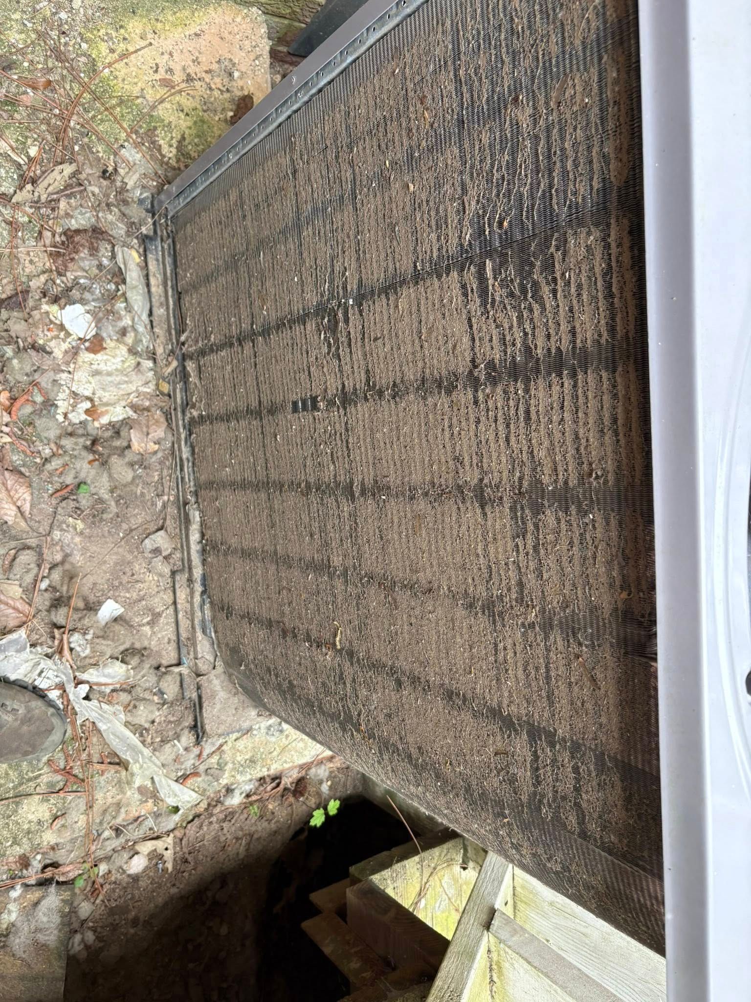 A close up of a door with a hole in it.