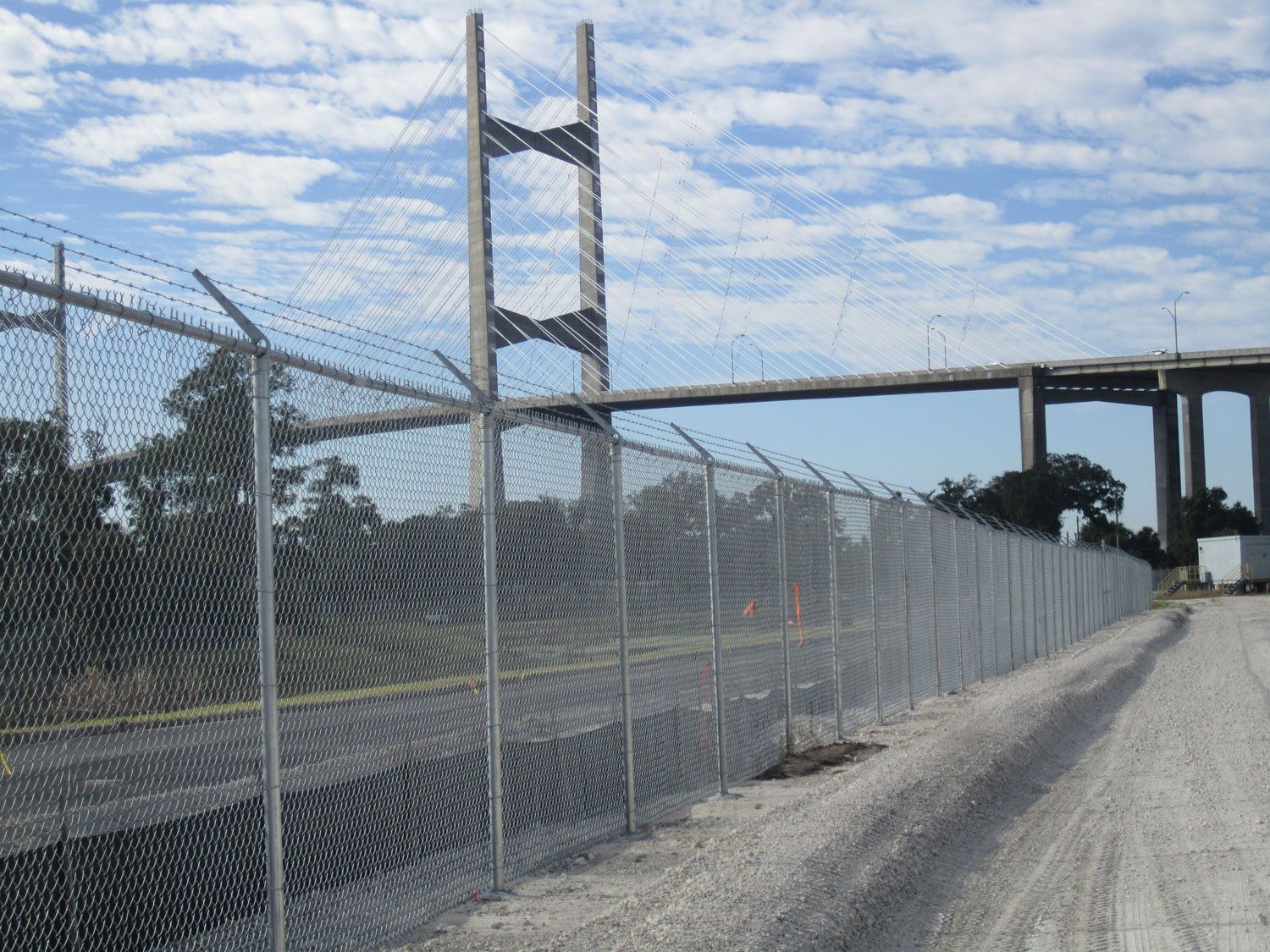 Chain Link Fence With Barb Wire On Side Of Road — Jacksonville, FL — Newsom Fence