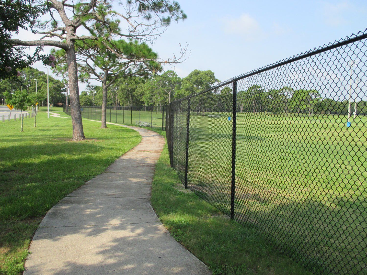Black Vinyl Commercial Grade Chain Link Fence — Jacksonville, FL — Newsom Fence