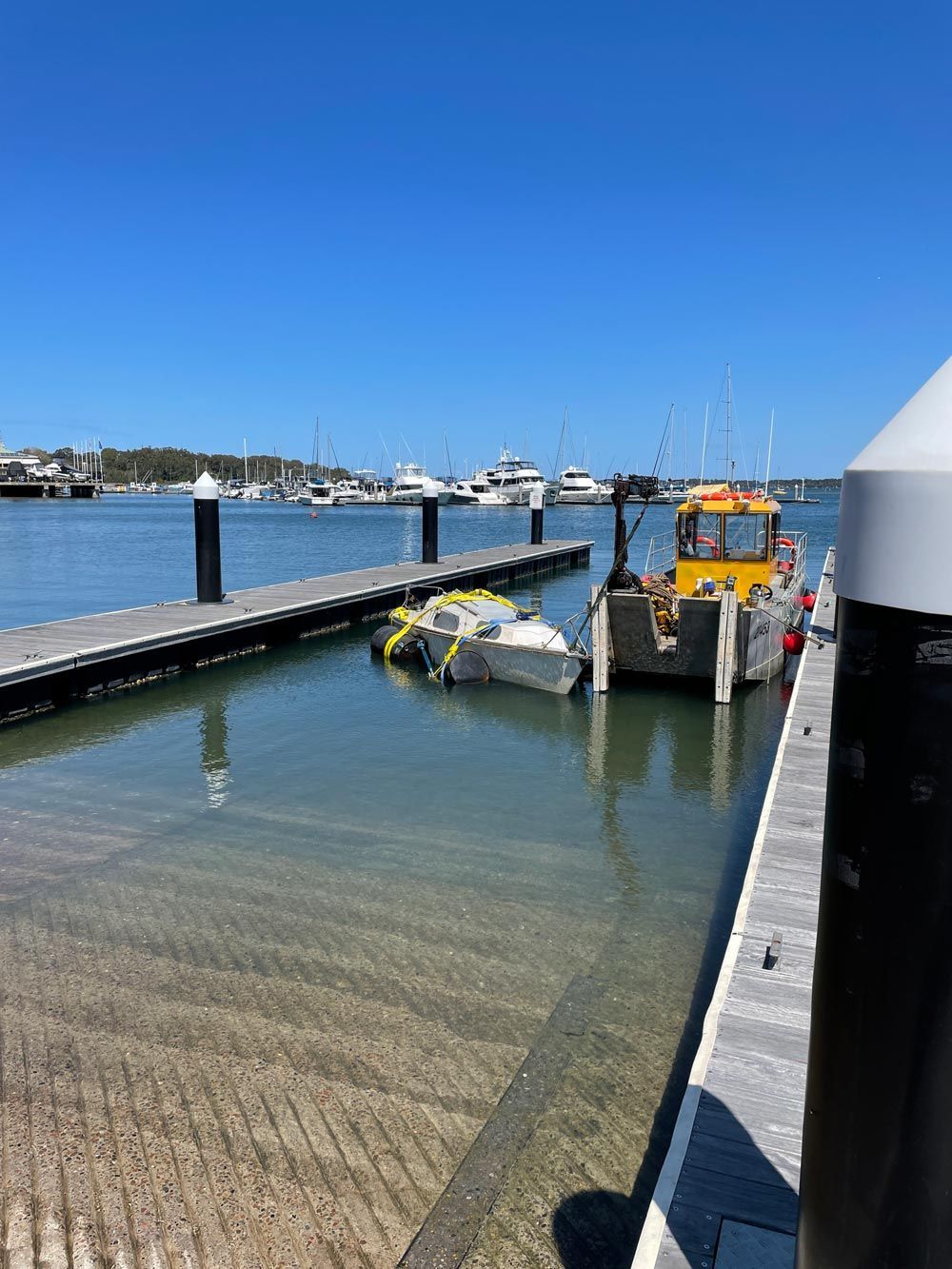 Broken Boat On The Boat Ramp Port — Salvaging in Port Stephens, NSW