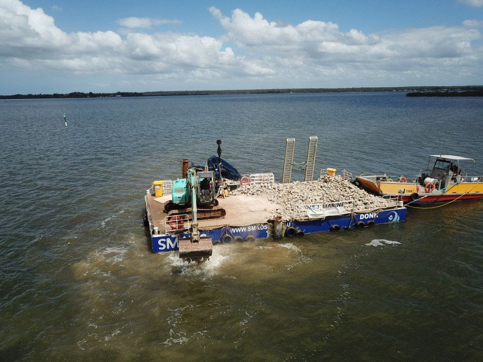 Excavator Along the Coast — M&J Marine Services in Medowie, NSW