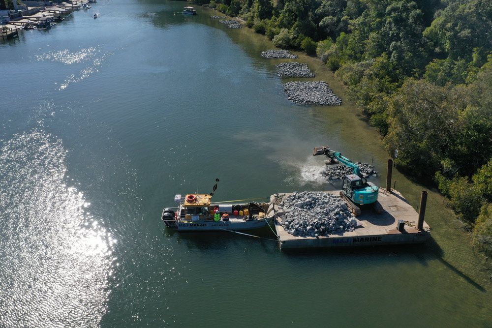 Top View Of Rocks Scattered Along the Coast — M&J Marine Services in Medowie, NSW