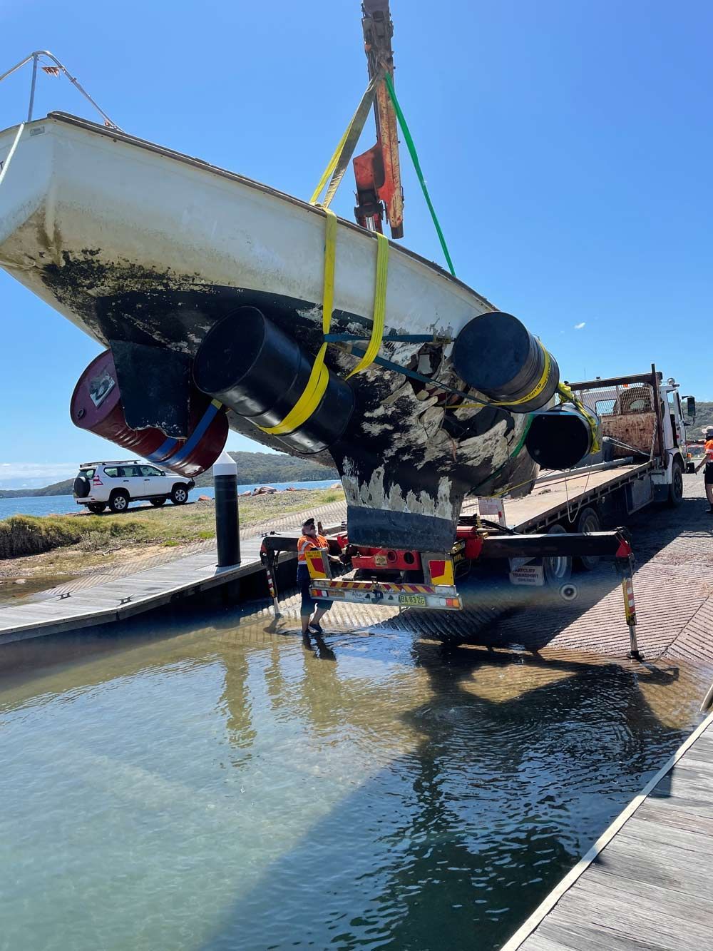 Lifting Up The Boat Using Crane — Salvaging in Port Stephens, NSW
