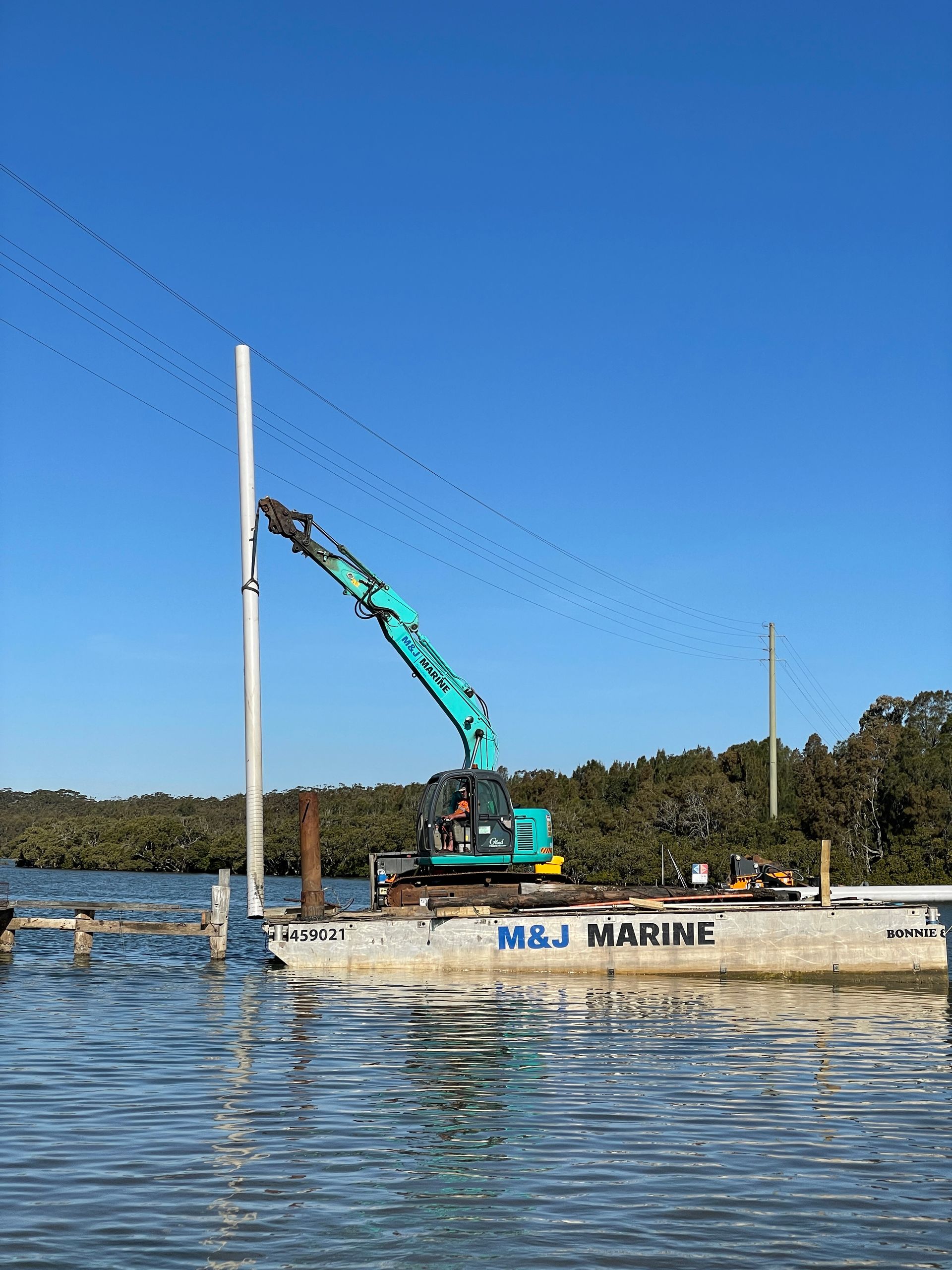Driving Piles Using Heavy Machinery — M&J Marine Services in Medowie, NSW