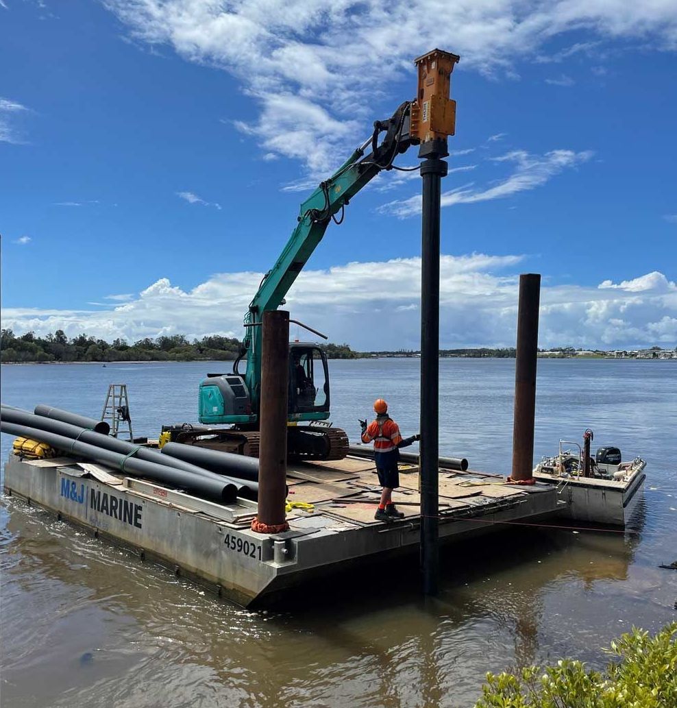 Two Workers Building The Plie Driving — Salvaging in Port Stephens, NSW