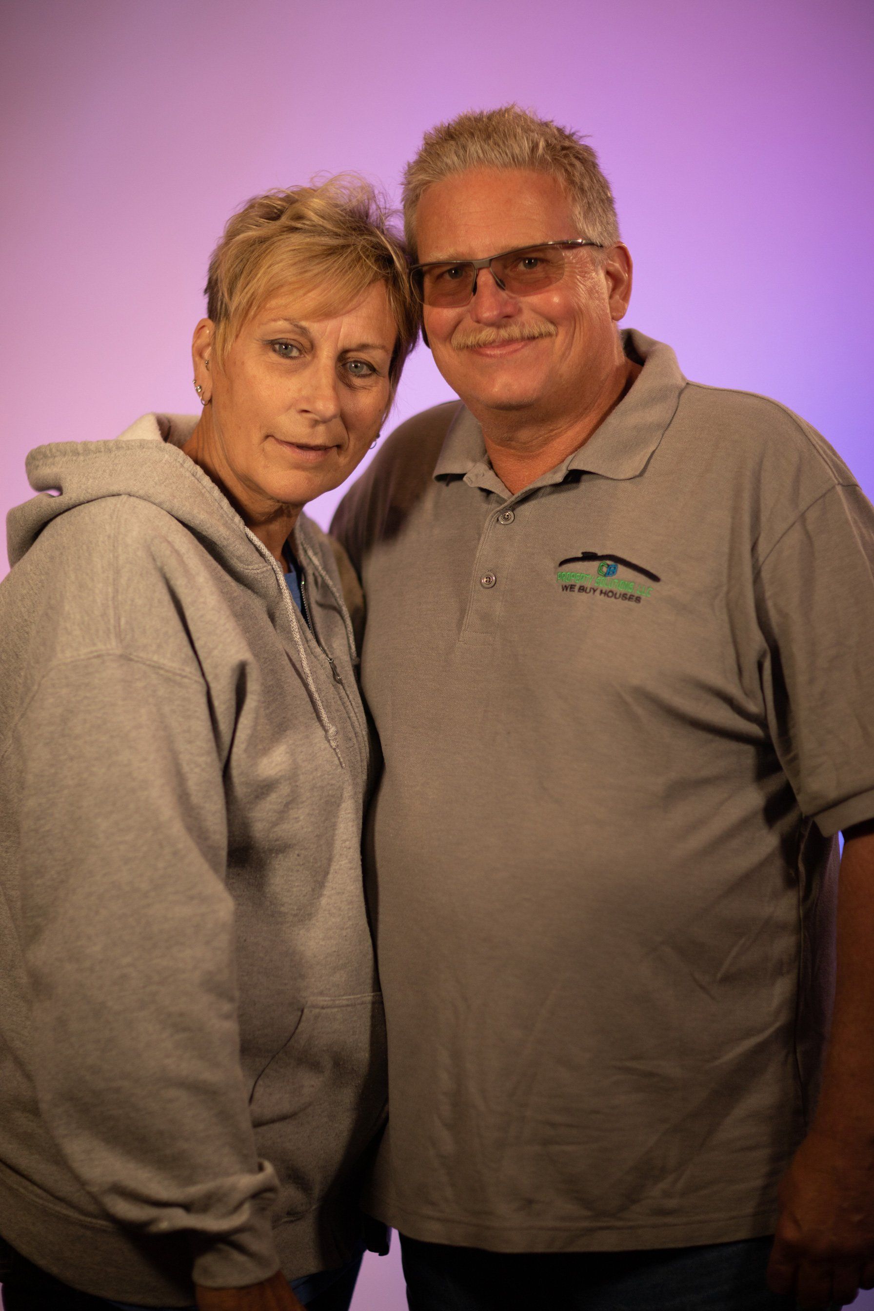 A man and a woman are posing for a picture together.