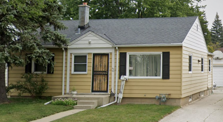 Before photo of a yellow house