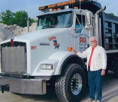Dump Truck Unloading Broken Concrete Slabs — Jacksonville, FL — Ray Gunter Dump Trucking