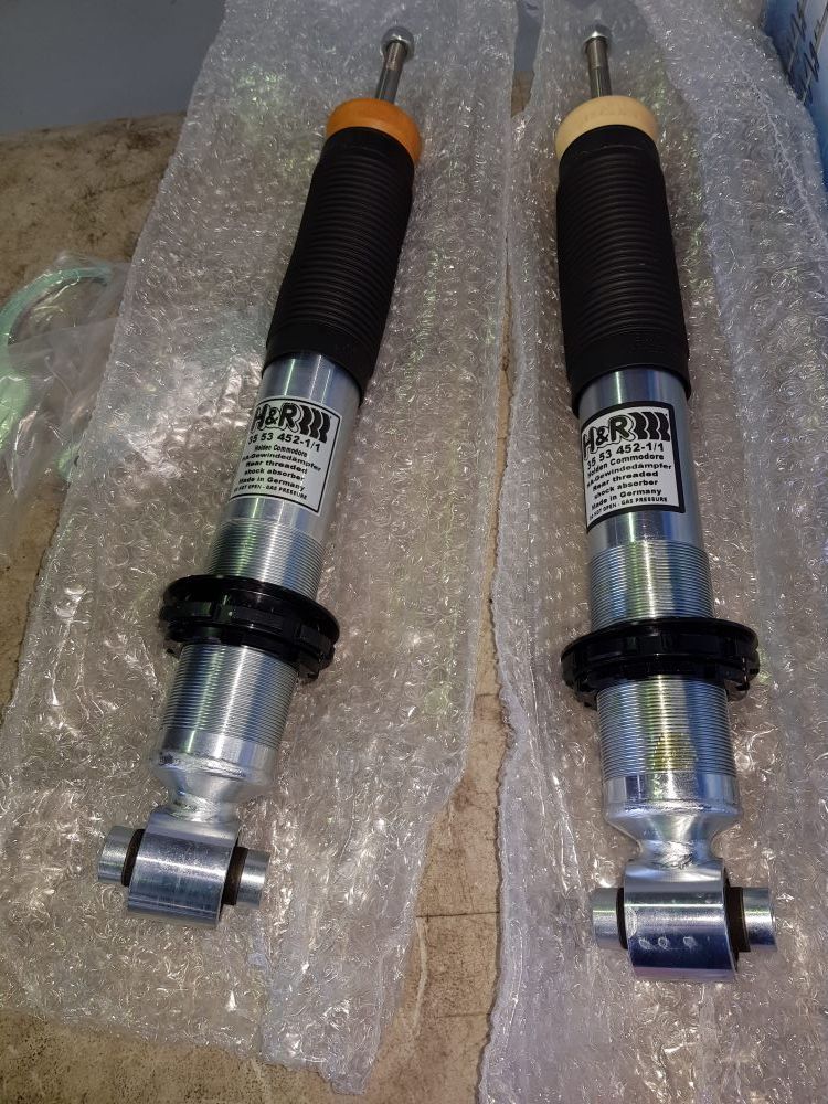 Two Silver And Black Kw Coilover Shocks On Bubble Wrap — Coasteer Automotive In Tuggerah, NSW