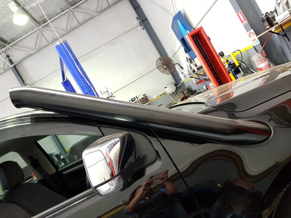 A Black Car With A Snorkel In A Garage — Coasteer Automotive In Tuggerah, NSW