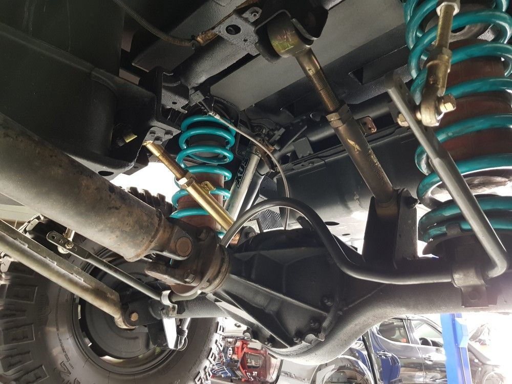 Undercarriage Of A Vehicle With Blue Suspensions — Coasteer Automotive In Tuggerah, NSW