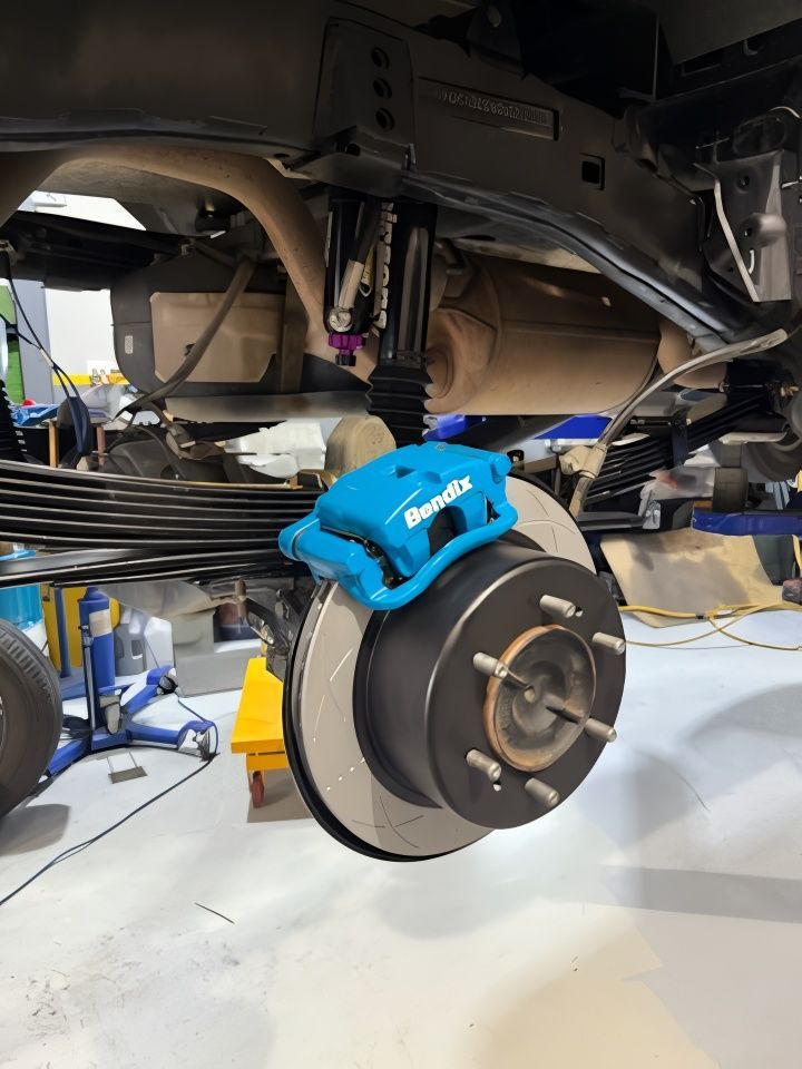 Blue Bendix Brake Caliper Installed On A Truck's Rear Wheel — Coasteer Automotive In Tuggerah, NSW