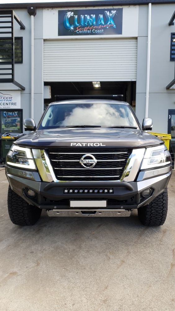 Dark Nissan Patrol Suv Parked In Front Of An Open Garage — Coasteer Automotive In Tuggerah, NSW